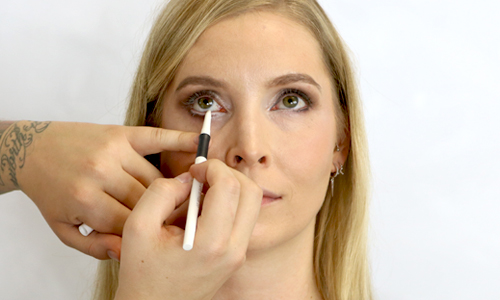 young woman with white eye styler