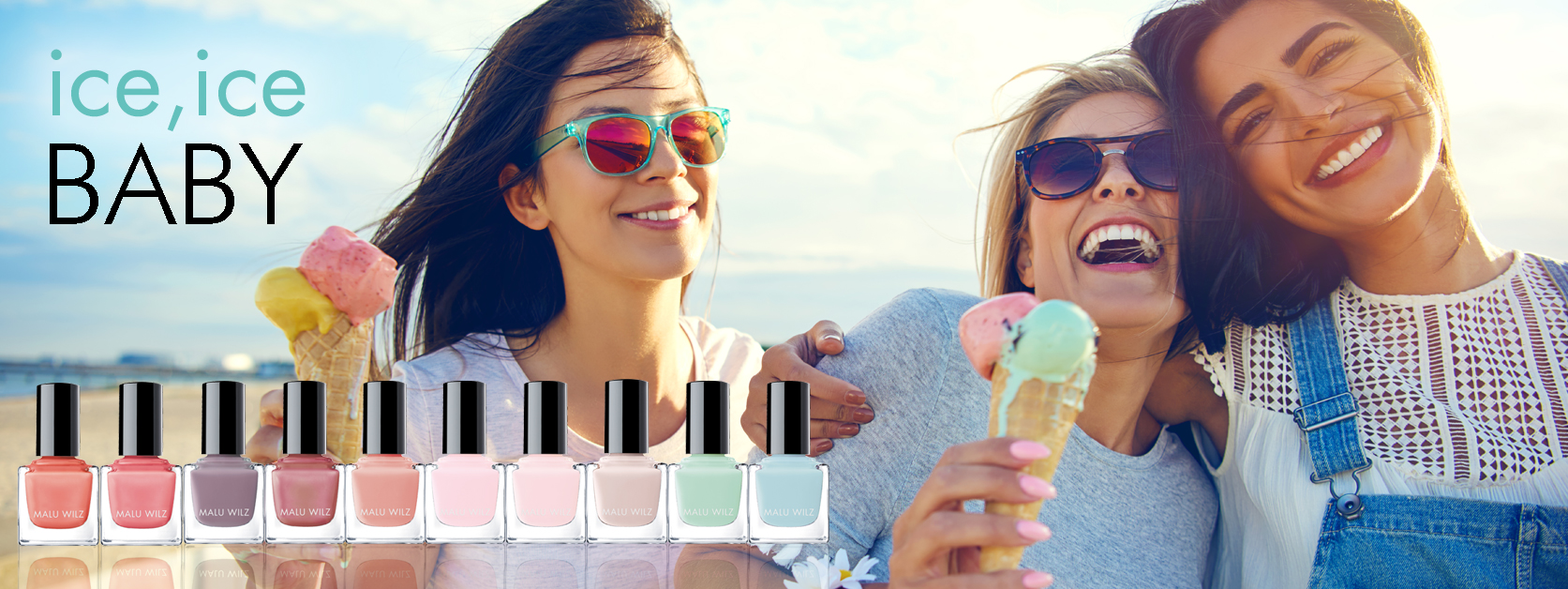 young women on the beach with ice cream and nail polish