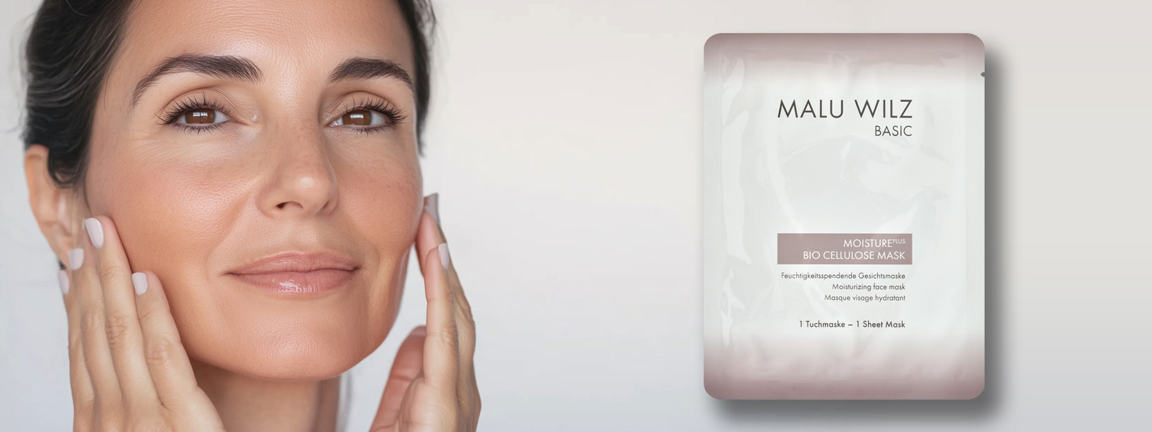 Experience a soothing mask with intense moisture! Face of a mature woman with hands and mask