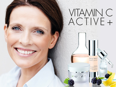 mature woman with skin care products