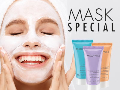 young woman with face mask and towel